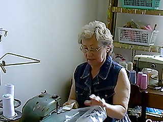 Hot grandma is playing naked with her hairy pussy and favourite toy